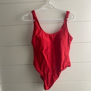 Red open back one piece swim suit